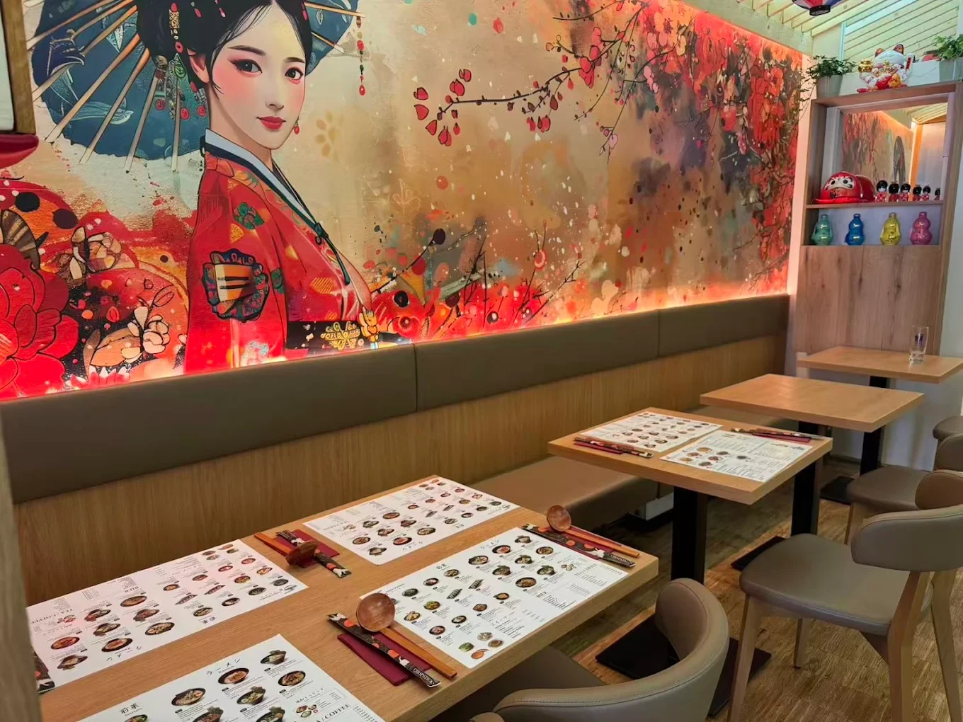 Seating at Hana Ramen beside a Japanese mural